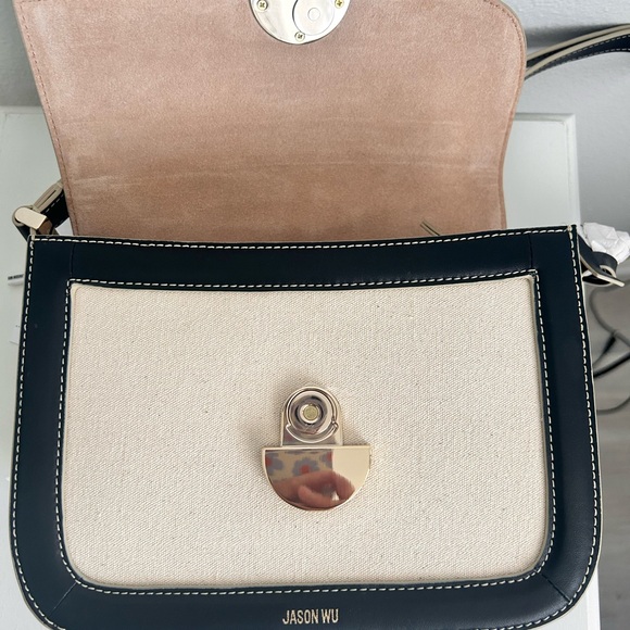 Jason Wu
Orbit Canvas / Leather Shoulder Bag NWT Color Beige/ Black - Picture 11 of 14